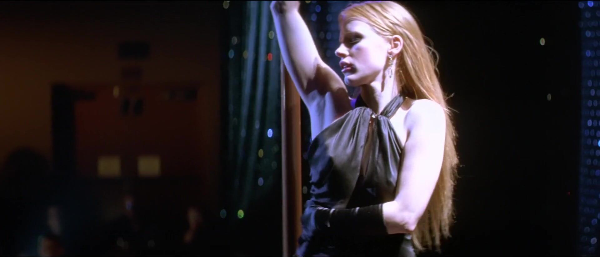 Curious Jessica Chastain moves around pole and pulls dress down showing boobies in Jolene (2008) Raw - 1