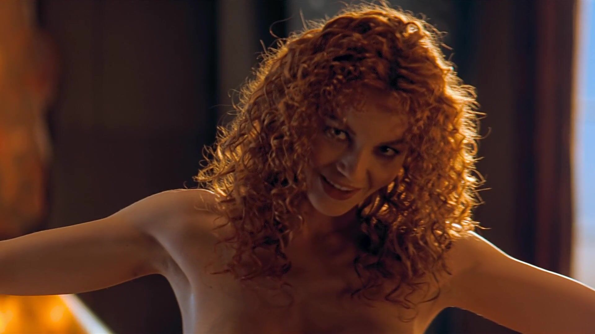 Soft Redhead Connie Nielsen exposes body in celebs video scene from The Devil's Advocate Stockings - 1